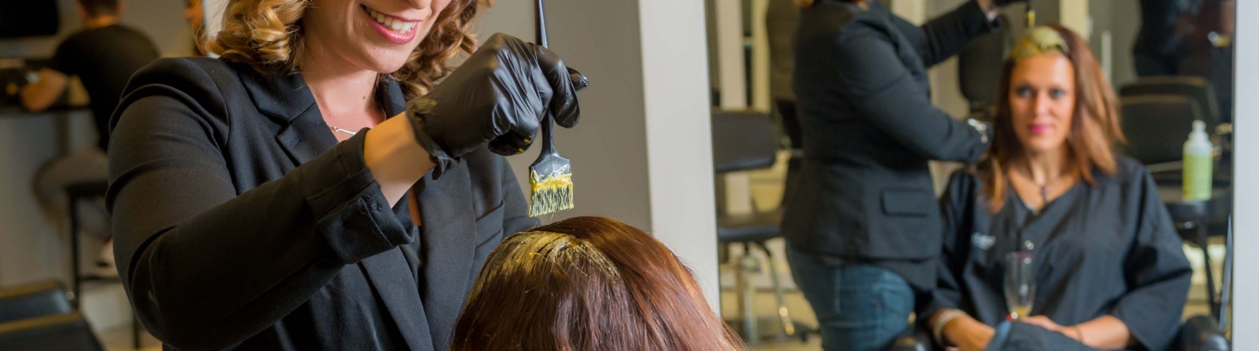 Woman Dying another Woman's Roots at a Naples Salon