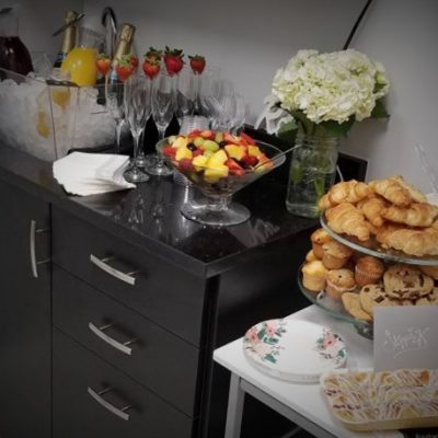 Fruit, Muffins, Champagne, and Utensils